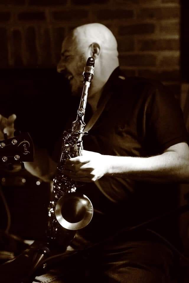 Live saxophonist performing at an EMU event